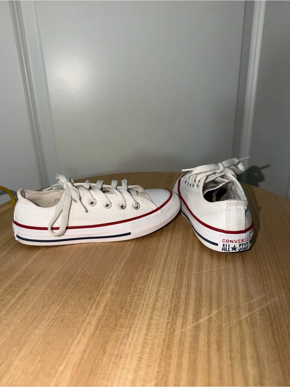 Converse Low Top Canvas Sneakers in White with Red Trim